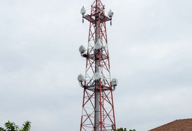 Modern office workspace with tech equipment and glowing circuit patterns on navy blue walls.