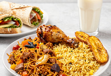 Close-up shot of a steaming, perfectly wrapped shawarma with vibrant vegetables spilling out on a rustic wooden board.