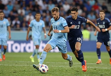 Competitive soccer match scene, high intensity, players in light blue and navy uniforms, sharp focus, professional sports photography.