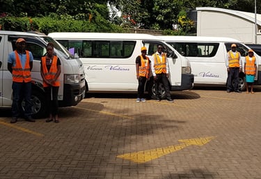 Professional staff standing by a fleet available for hire or leasing from Vanna Ventures