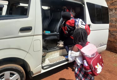 Students wearing backpacks board a white school van by Vanna Ventures for private transport.