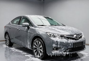 Shiny exterior of a luxury car freshly hand-washed and gleaming under sunlight.