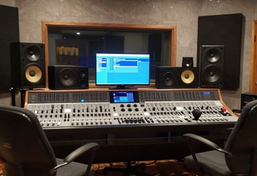 Film crew working on set with cameras, lighting, and technical equipment in action.