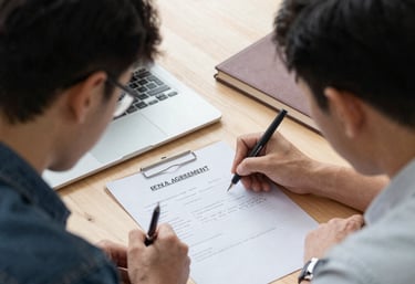 a man riding a skateboard down a street next to tall buildings