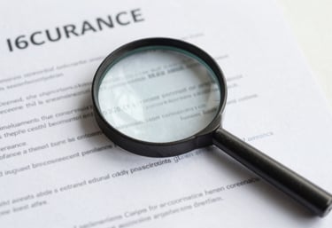 A minimalist flat lay of a magnifying glass over a clean insurance document, focusing on transparency and clarity, with #6C9DD1 color touches.