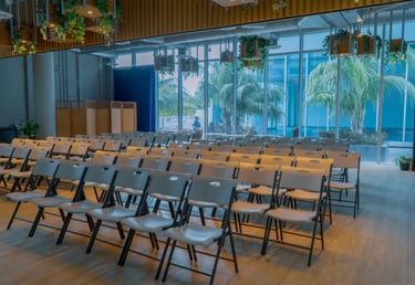 a room with chairs and tables and chairs