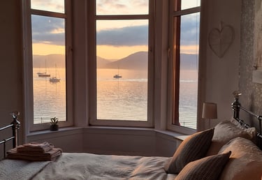 The bedroom at Gourock Seaview Holiday Let with a view of the ocean and boats