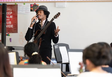 artist Christylez Bacon leads orchestra students in a workshop (credit: Joyce Naltchayan Boghosian)