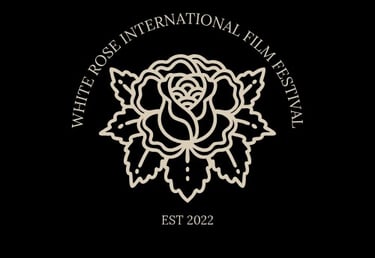 Logo del Festival de Cine The white rose, colaborador de Take One Academy