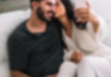 a man and woman sitting on a couch