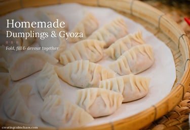 Freshly pleated homemade dumplings and gyoza arranged in a bamboo steamer basket.