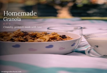 Homemade granola with raisins and oats in a heart-patterned bowl served with fresh milk.