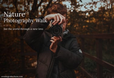 A young boy holds a camera during a nature photography walk in a forest.