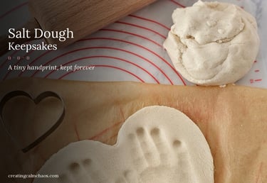 Salt dough keepsake heart with child's handprint imprint next to dough and cookie cutter.