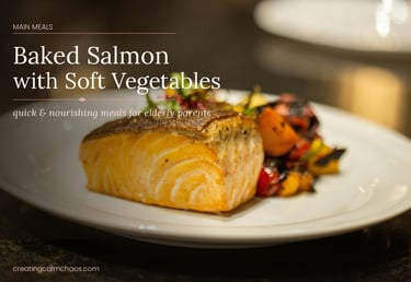 Baked salmon fillet served with roasted soft vegetables on a white plate for a healthy elderly meal.