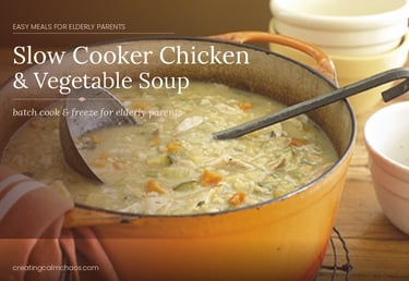 Healthy slow cooker chicken and vegetable soup in an orange pot, an easy meal for elderly parents.