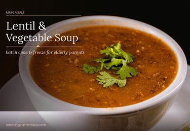 A bowl of healthy lentil and vegetable soup garnished with fresh cilantro for a meal prep recipe.