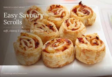 Golden brown cheesy savoury scrolls made with flaky puff pastry and pizza toppings on a white plate.