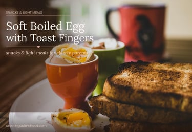 A soft boiled egg in an orange cup served with crispy toast fingers for a healthy snack.