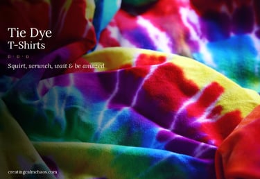 Vibrant colorful tie dye t-shirt fabric with rainbow swirls and spiral patterns.