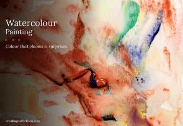 Abstract watercolor painting with vibrant red, blue, and green splatters on textured art paper.