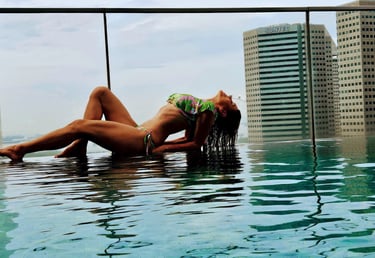 woman relaxing  at infinity pool Andaz Hyatt Singapore