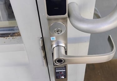 Biometric keypad smart lock on commercial building entrance
