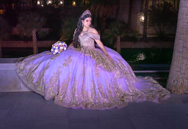 a woman in a purple dress sitting on a bench