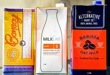 Cartons of soy, almond and oat milk in a cafe of Melbourne