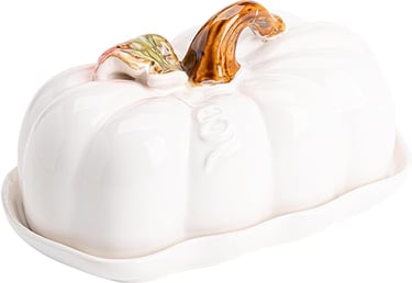 A white ceramic pumpkin shaped butter dish with a brown pumpkin stem and a green leaf as the top handle.