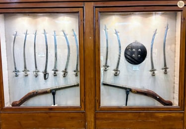 Historic weapons collection — swords, katars, and shields — at Bundi Government Museum.