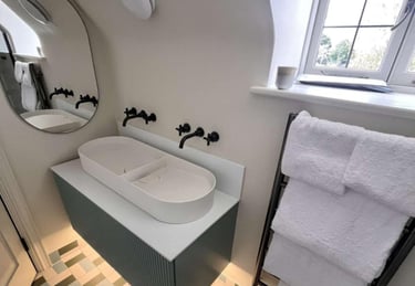 a bathroom with a bathtub and a mirror Bathroom with bathtub and wall mirror installed by PBP Servic