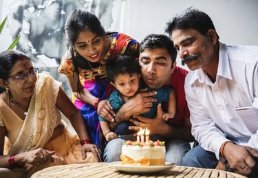 a family celebrating a birthday party with a cake