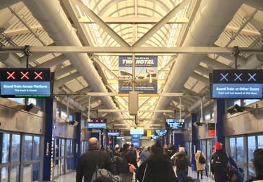 JFK AirTrain platform with the rean and blue X indicators