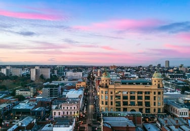 A drone image looking south down Chapel Street Precinct at sunrise