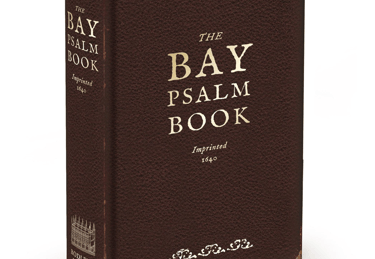 A hardcover edition of The Bay Psalm Book with a dark brown textured cover 