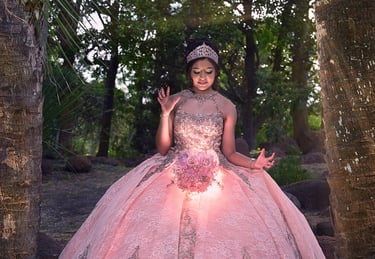 a woman in a pink dress posing for photographer