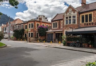 Historic brick architecture and local restaurants on a sunny street in Quinta Camacho gastronomic zone