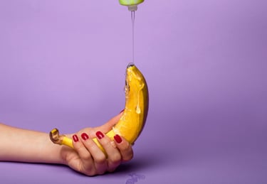 a banana peeler being held by a person's hand