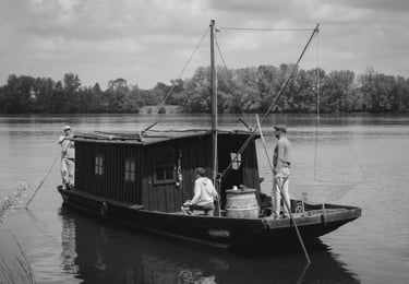a man standing on a boat in the water