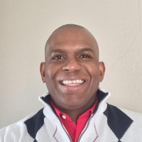 Jireh Gibson in a white sweater and a red shirt