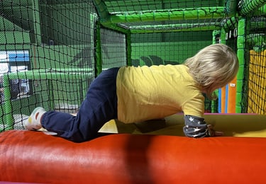 Boy on soft play at Frankie and Lolas