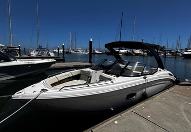 a boat docked at a dock with a boat in the water