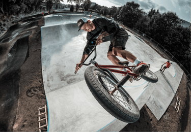 a man riding a bike on a ramp