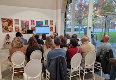 a group of people sitting in chairs in a room