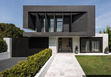 a modern house with a black and white exterior