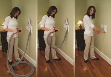 a woman is using a vacuum cleaner to clean her house