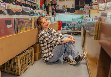 Senior pictures in a record store by Lititz PA senior picture photographer. Senior Rep Team Lancaster PA
