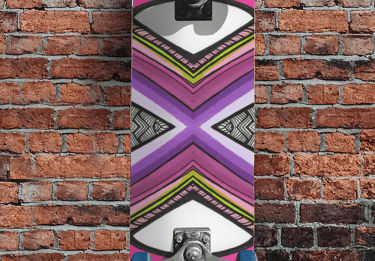 a skateboarder is standing next to a brick wall