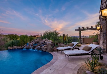 a pool with a waterfall and a waterfall